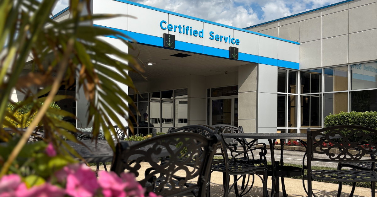 Certified Service entrance with outdoor patio seating at Patriot