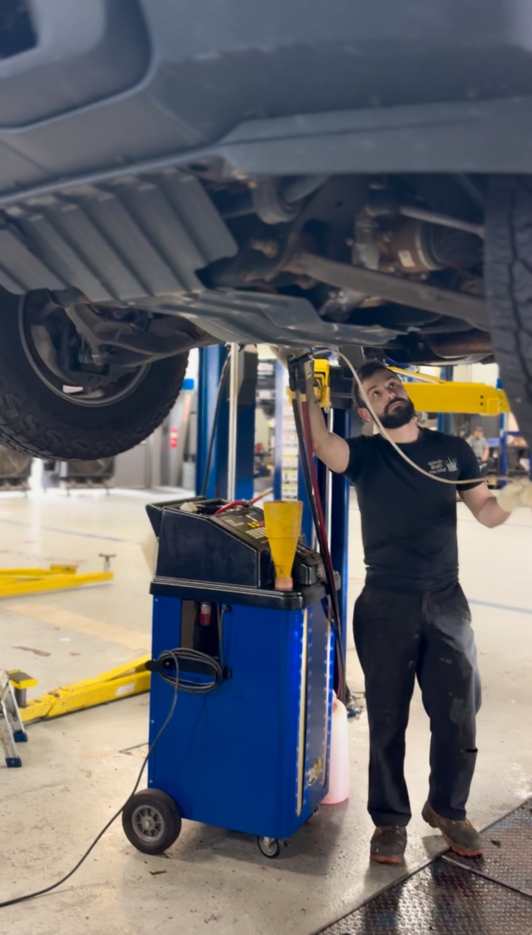 Tech working underbody in the bay