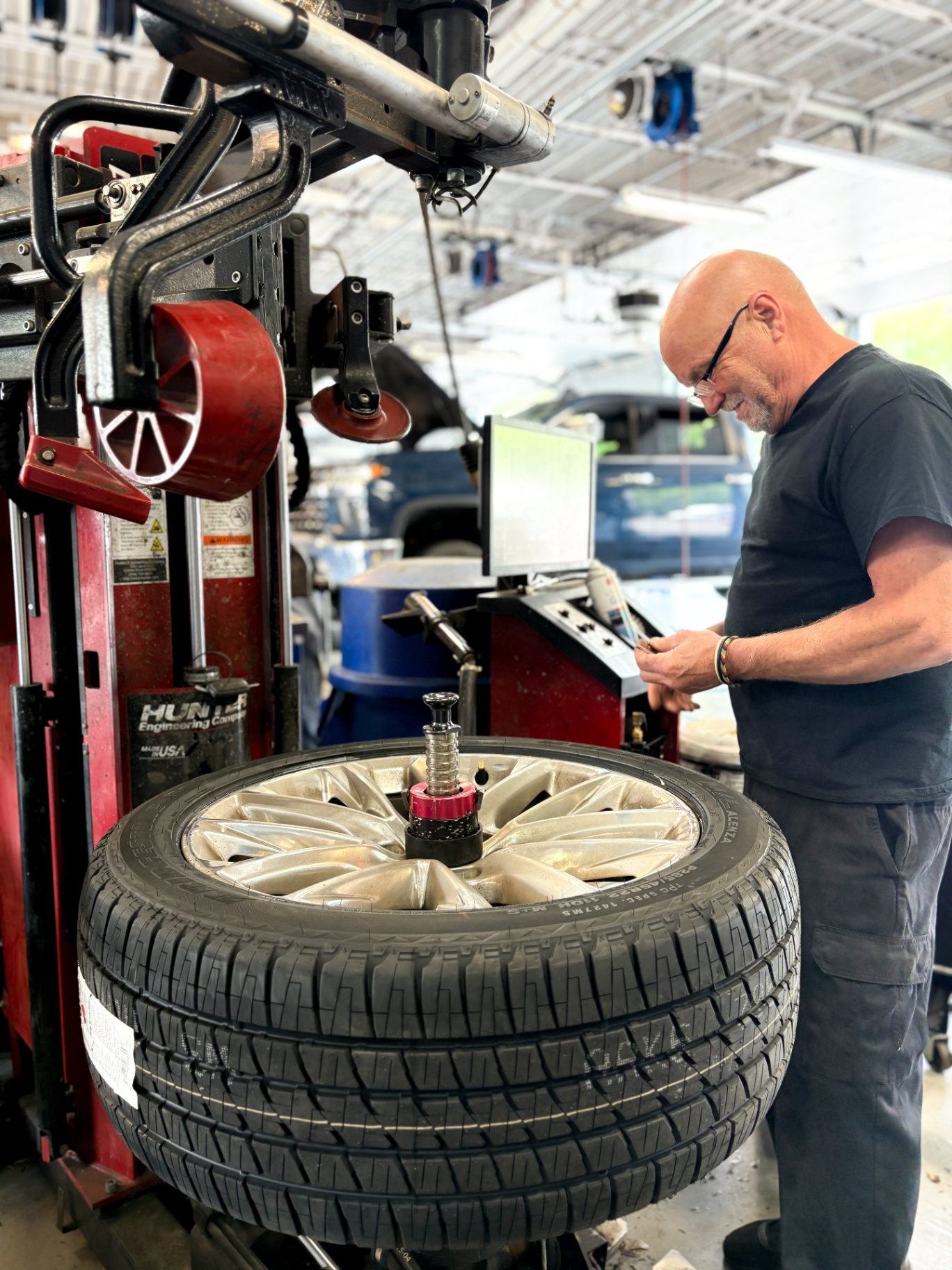Patriot tech mounting a tire on a Hunter tire changer