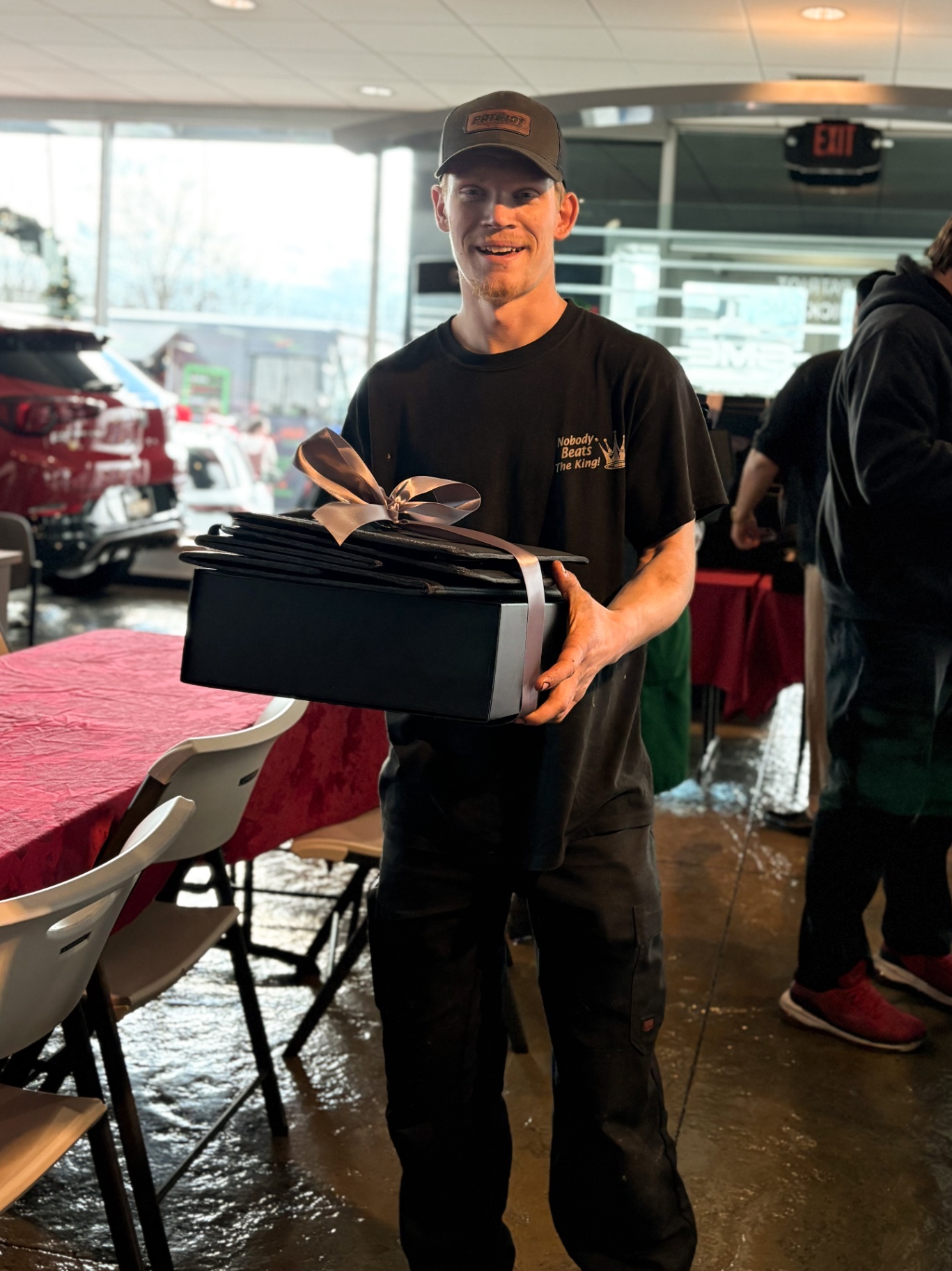 Technician alongside a new toolbox in a shop environment.
